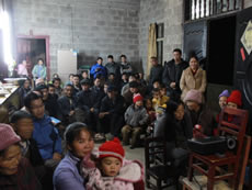 Namo villagers in Fengshan giving feedbacks to the evaluation team on a community project.